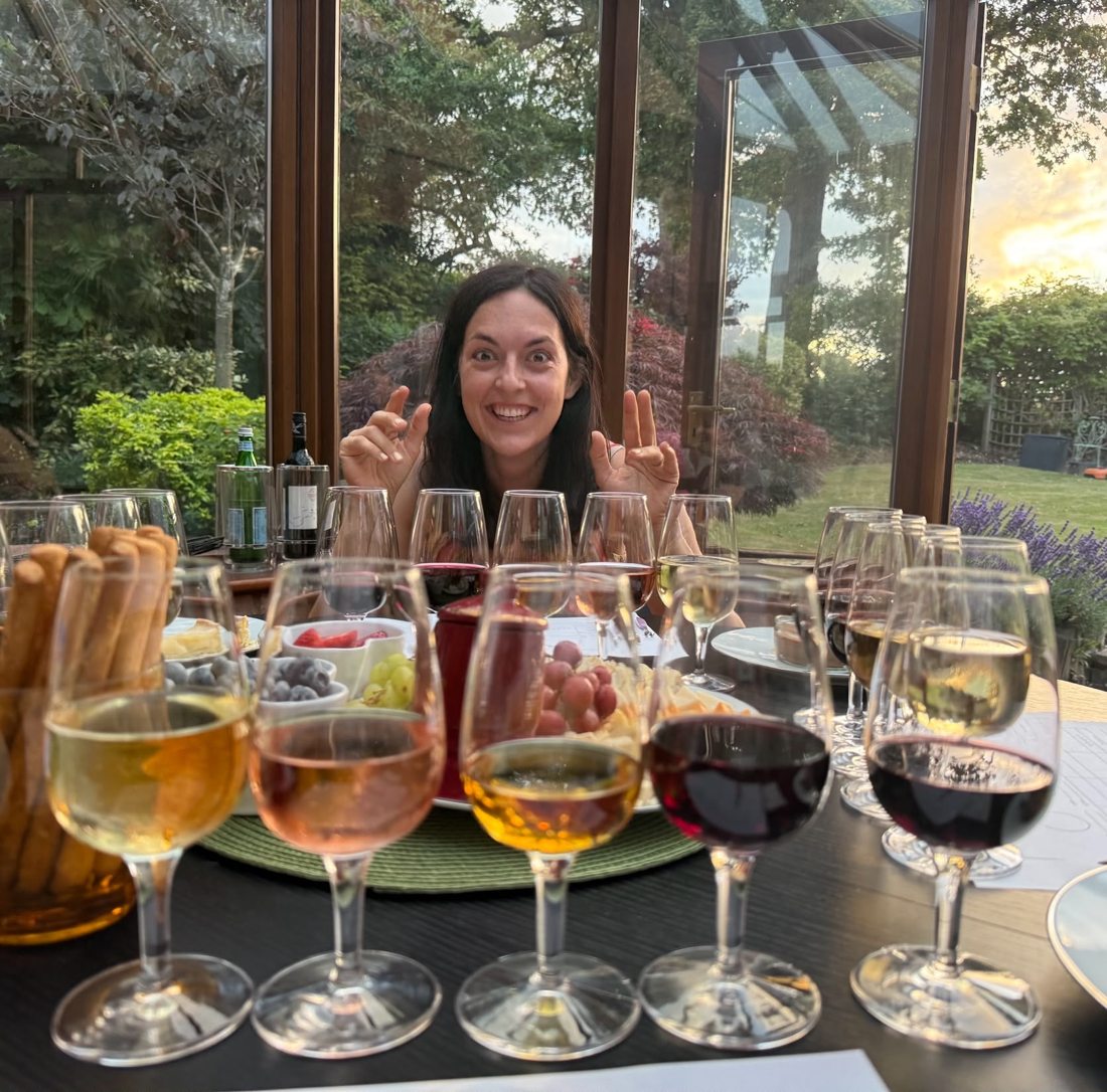 A playful moment behind a flight of wines